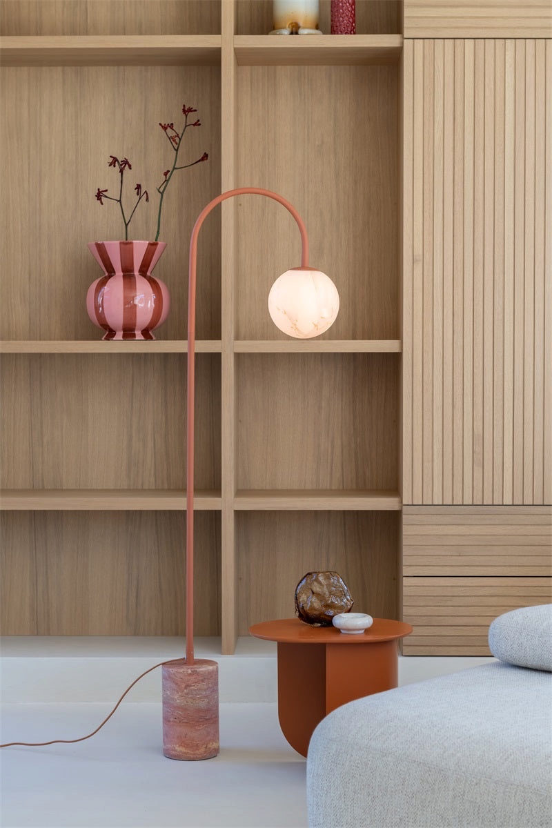 My Store 5 Tivoli floor lamp in terra with a travertine base and spherical glass shade in a modern living room